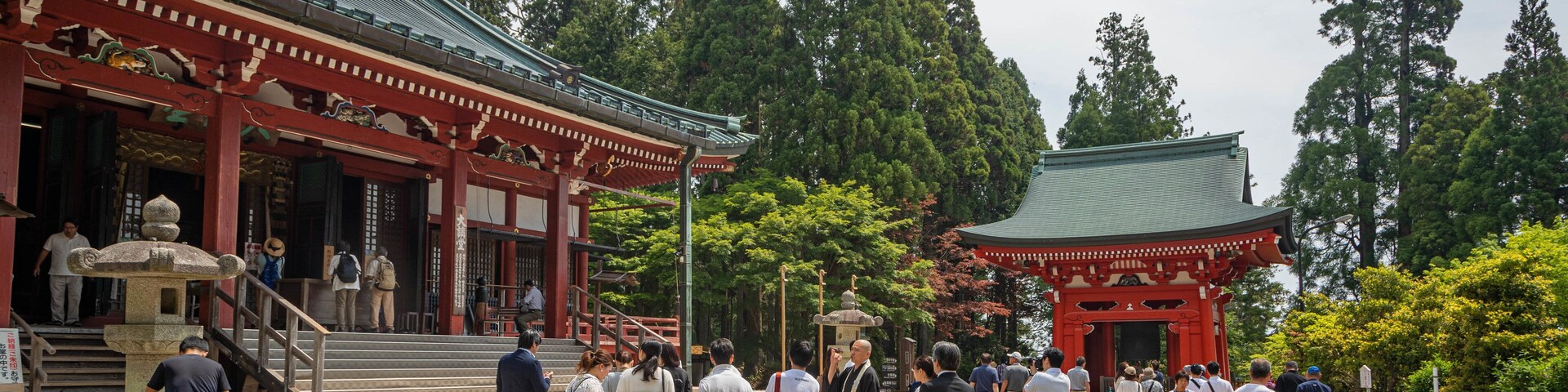 Enryakuji Temple featuring heritage elements and a temple or place of worship as well as a small group of people