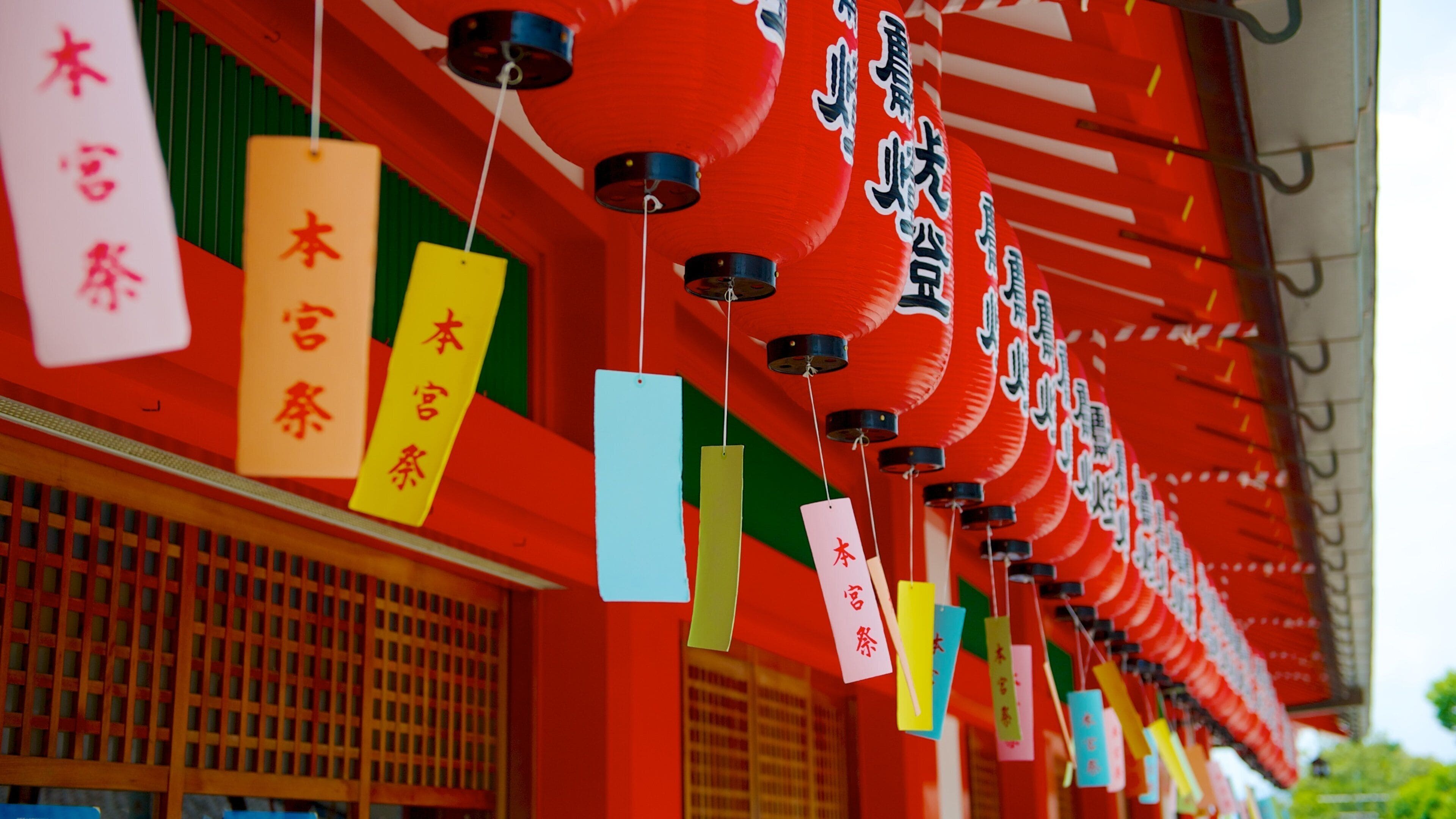 Fushimi Inari Shrine which includes signage, heritage architecture and a temple or place of worship