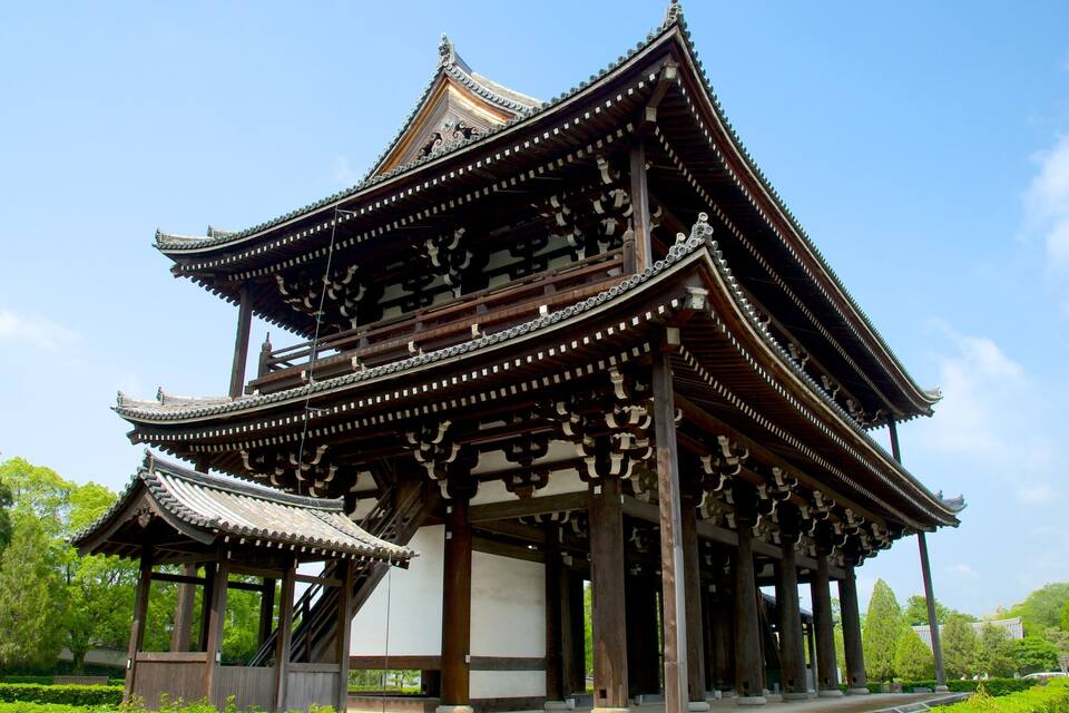 A traditional East Asian pavilion with ornate wooden architecture and a tiled roof.