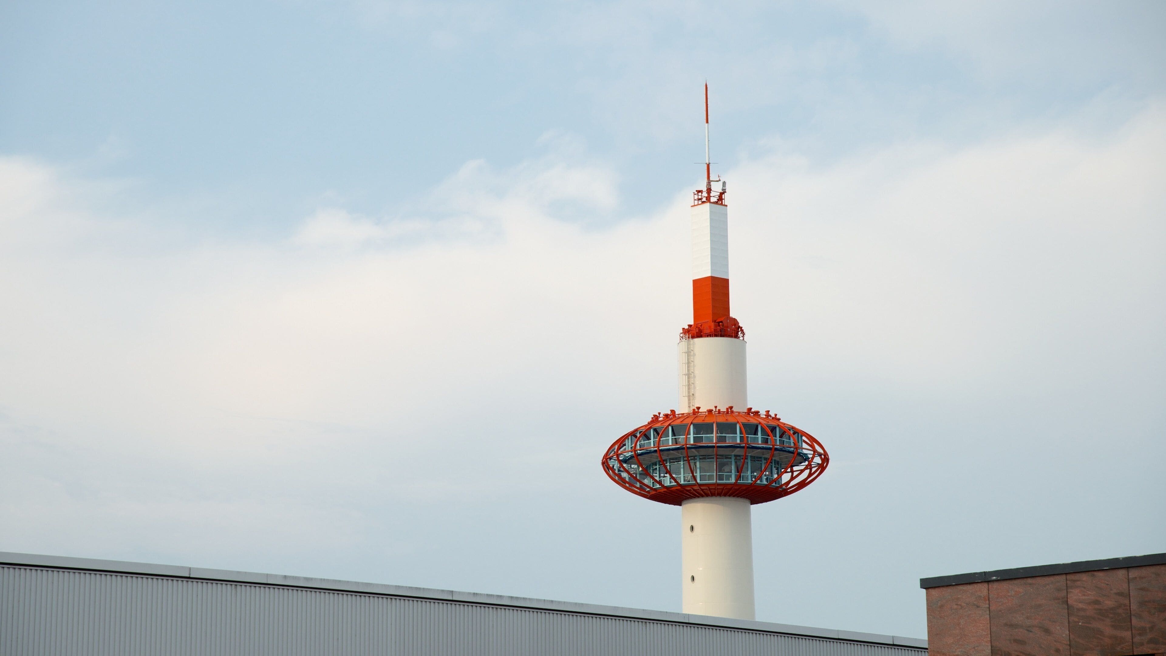 Kyoto Tower featuring modern architecture, a city and central business district