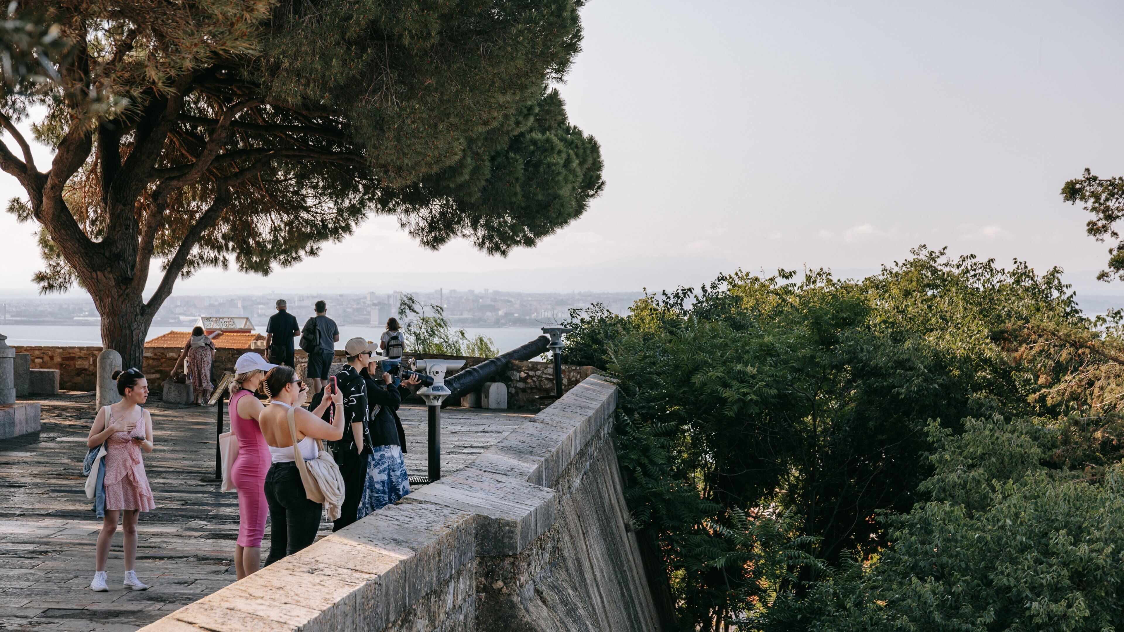 Castle of São Jorge featuring views as well as a small group of people