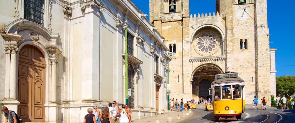 Lisbon Cathedral showing a city, a church or cathedral and street scenes