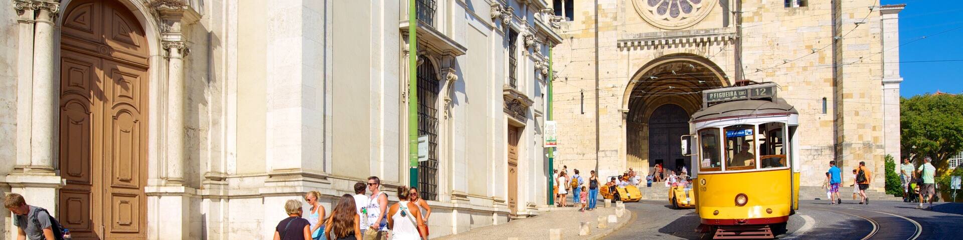 Lisbon Cathedral showing a city, a church or cathedral and street scenes