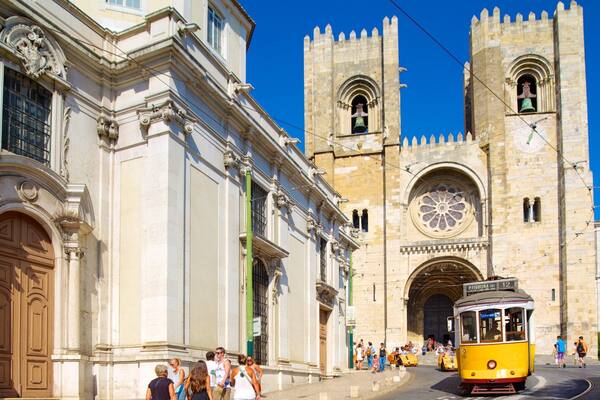 Lisbon Cathedral showing a city, a church or cathedral and street scenes