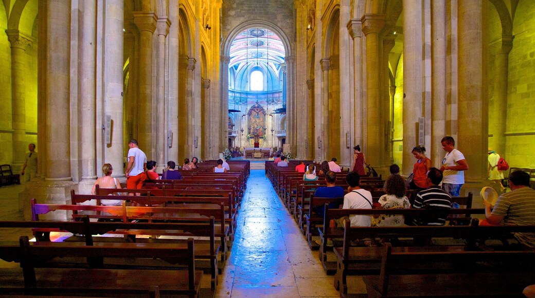 Lisbon Cathedral which includes interior views, heritage architecture and a church or cathedral
