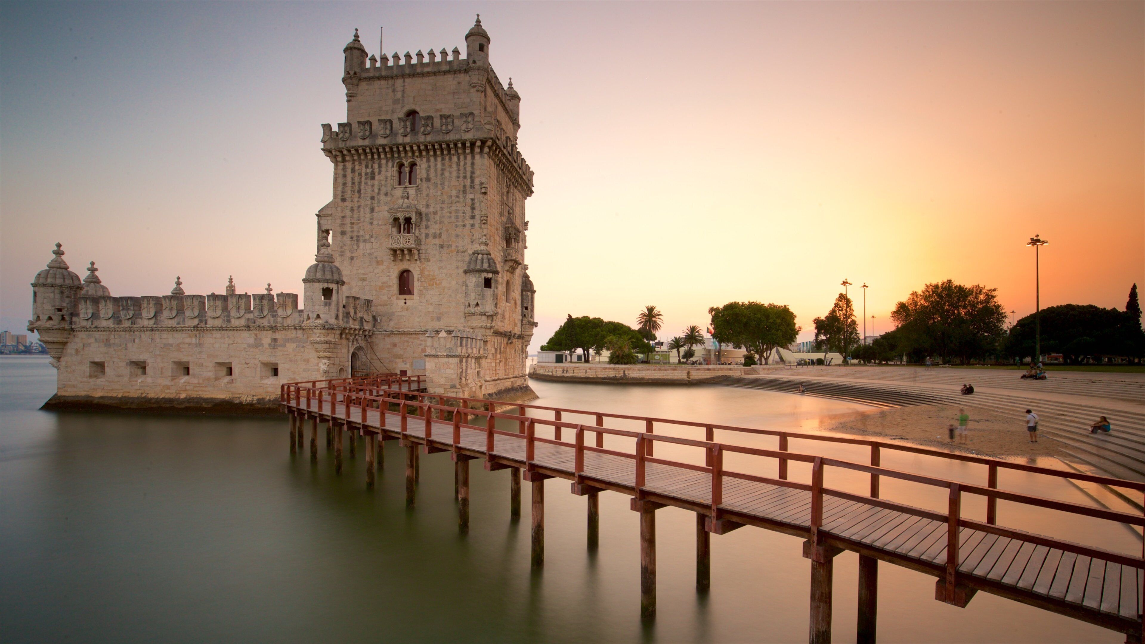 Belem Tower which includes heritage architecture, a bridge and general coastal views