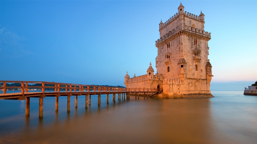 Belem Tower which includes a bridge, a lake or waterhole and heritage architecture