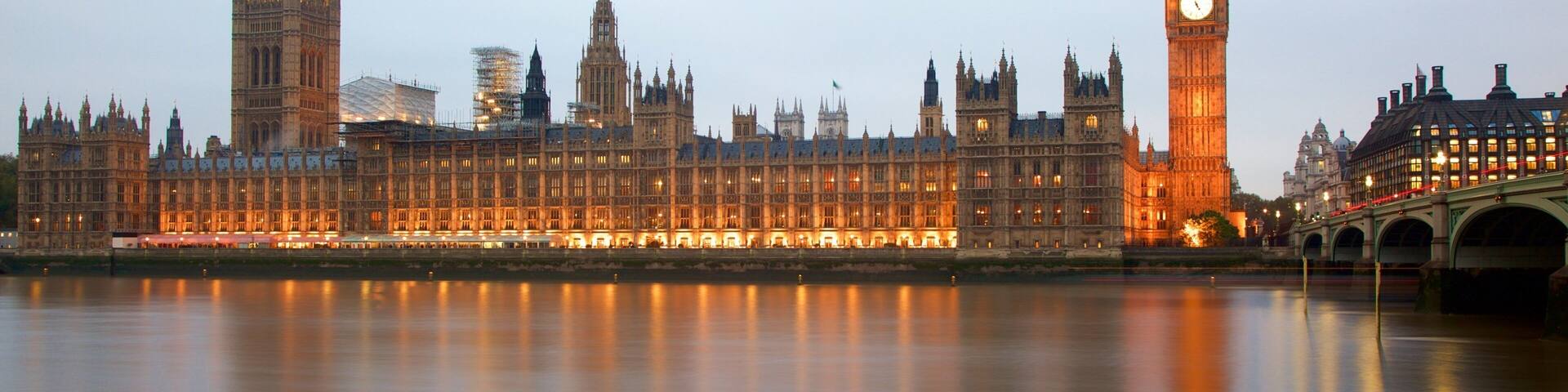 Houses of Parliament showing a river or creek, a monument and heritage architecture