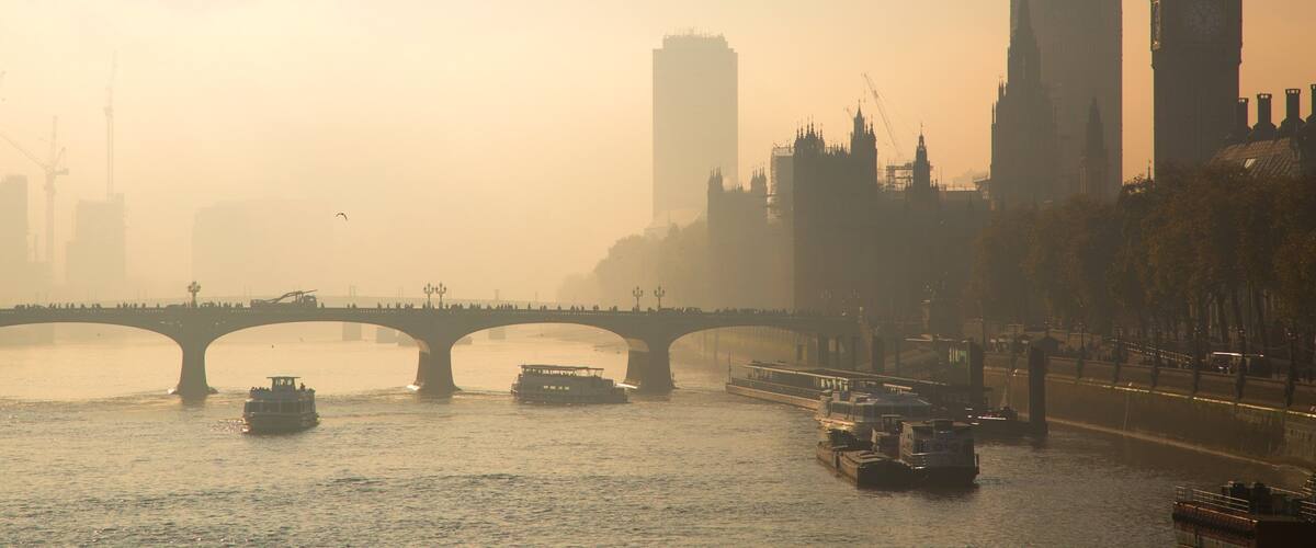 Houses of Parliament which includes a city, a sunset and a marina