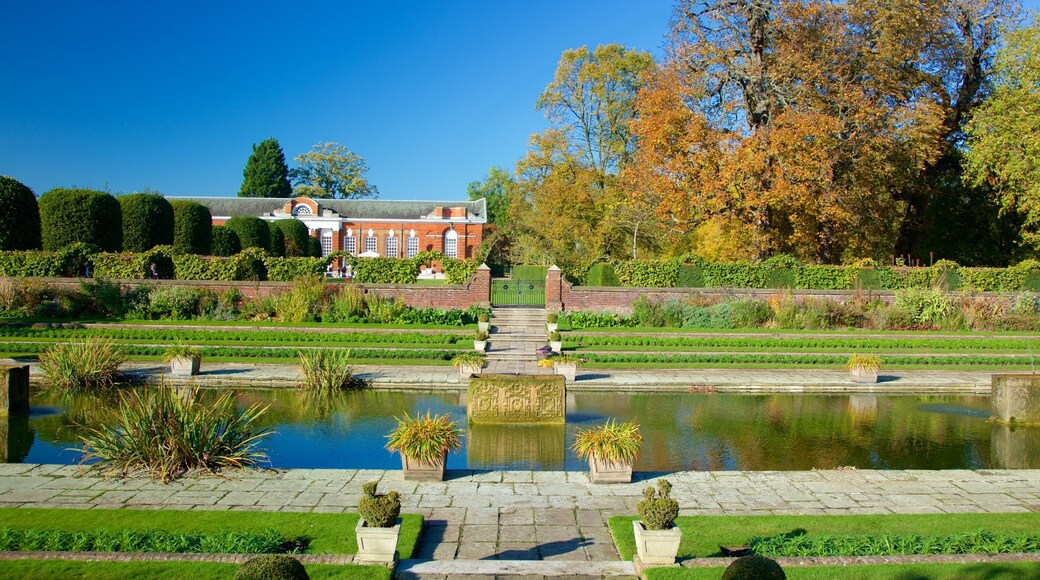 Kensington Palace featuring a garden, chateau or palace and a pond