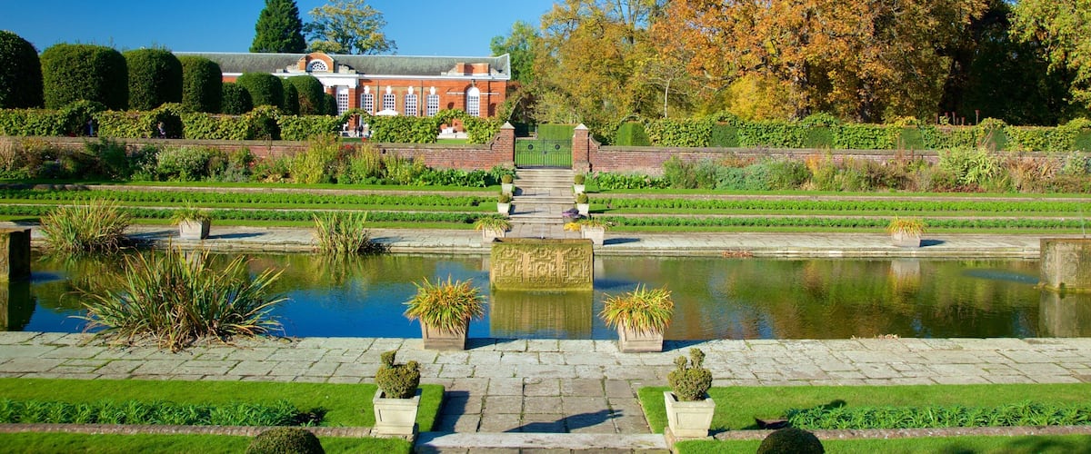 Kensington Palace featuring a garden, chateau or palace and a pond