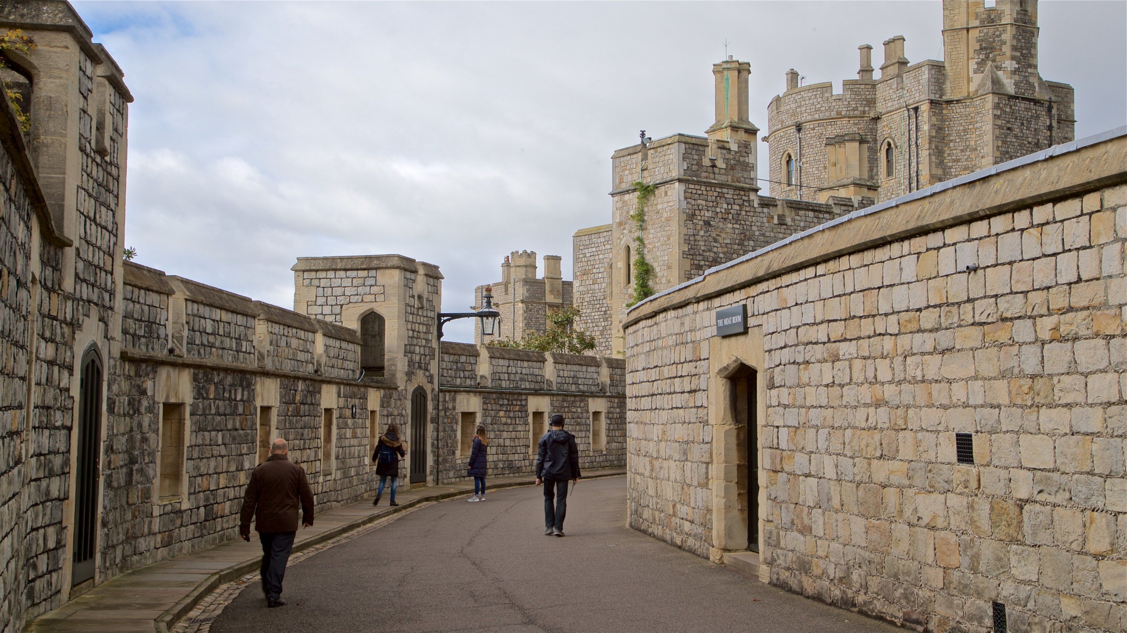 Windsor Castle featuring chateau or palace and heritage architecture as well as a small group of people