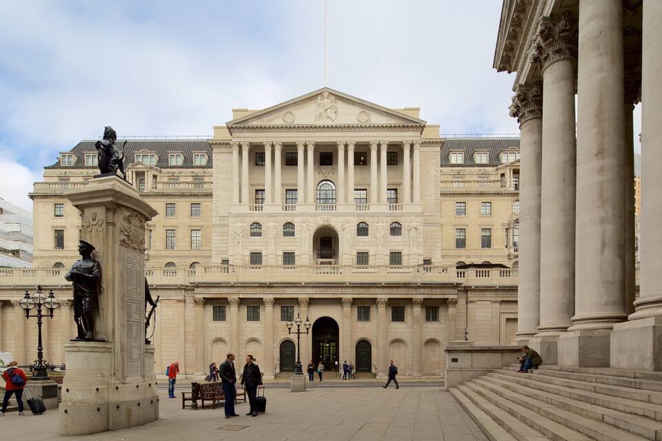 A large neoclassical building with columns, statues, and a central pediment.
