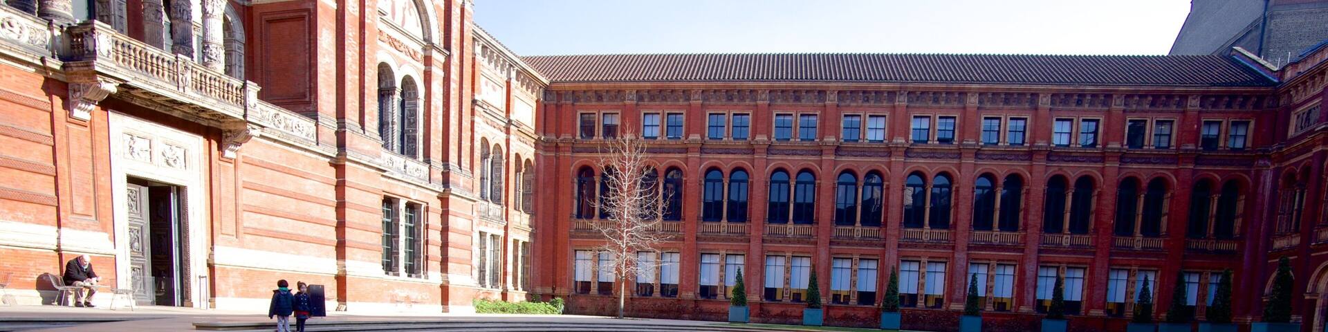 Victoria and Albert Museum showing a square or plaza and a fountain