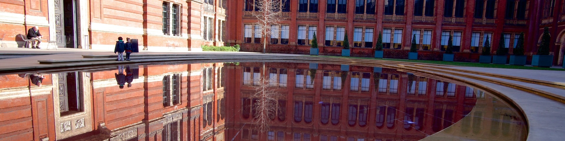 Victoria and Albert Museum which includes a square or plaza and a fountain