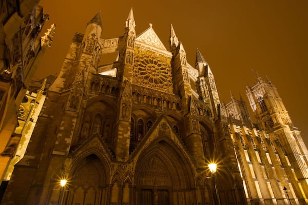 Westminster Abbey which includes religious elements, night scenes and a church or cathedral