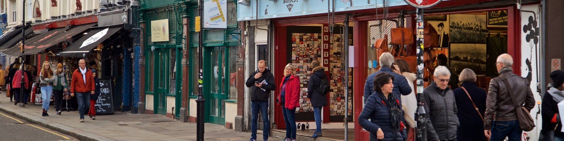 A street with shops, including a Portobello Market.