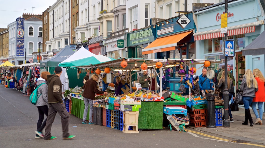 Portobello Roadin markkinat featuring markkinat ja katunäkymät sekä pieni ryhmä ihmisiä