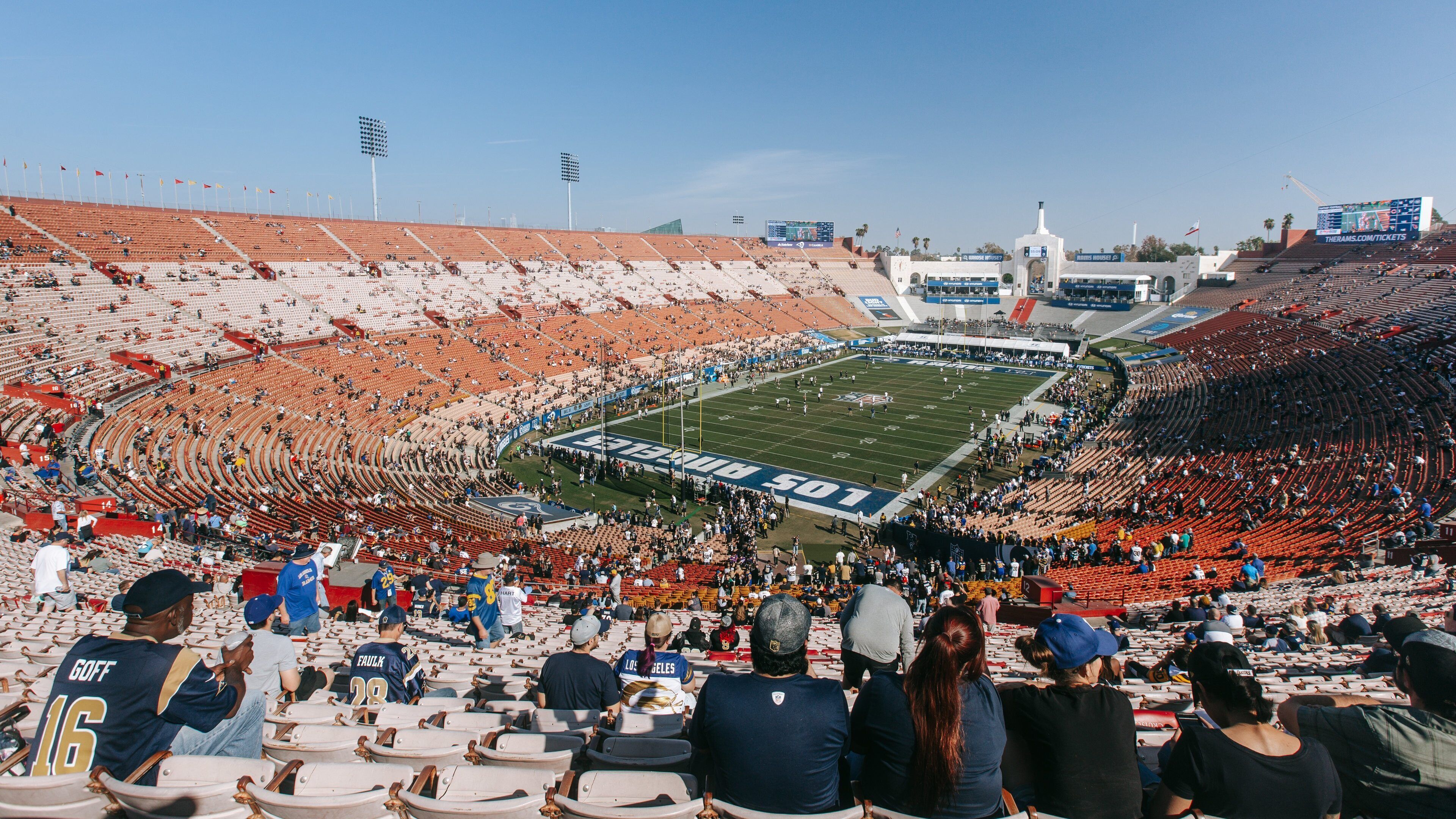 Los Angeles Memorial Coliseum showing landscape views and a sporting event