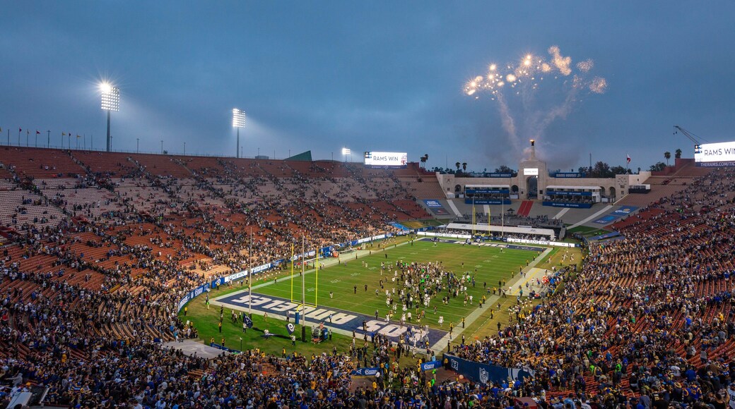 Los Angeles Memorial Coliseum which includes night scenes as well as a large group of people