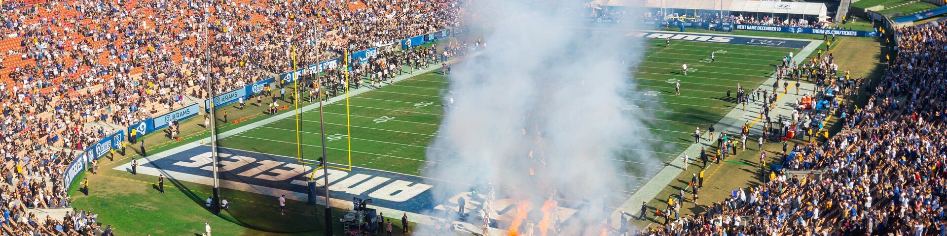 Los Angeles Memorial Coliseum featuring performance art as well as a large group of people