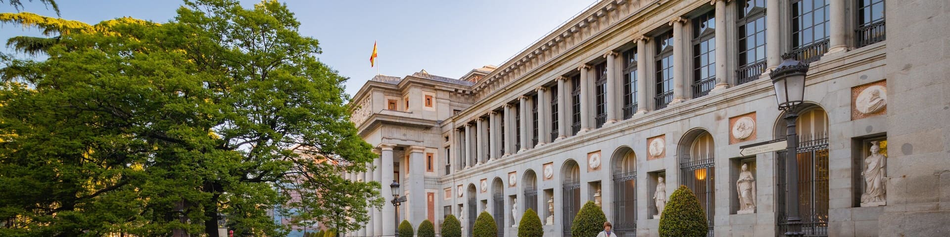 Prado Museum featuring a garden and heritage architecture
