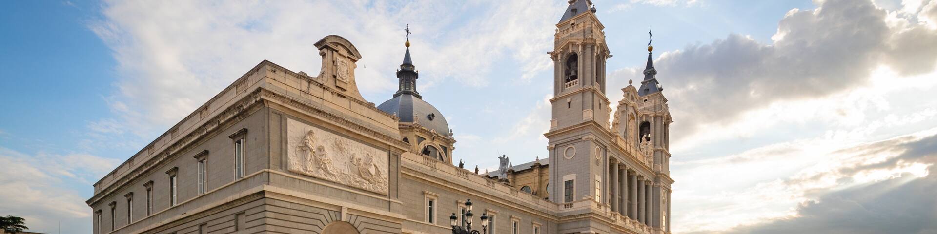 Almudena Cathedral featuring a sunset, heritage architecture and a church or cathedral