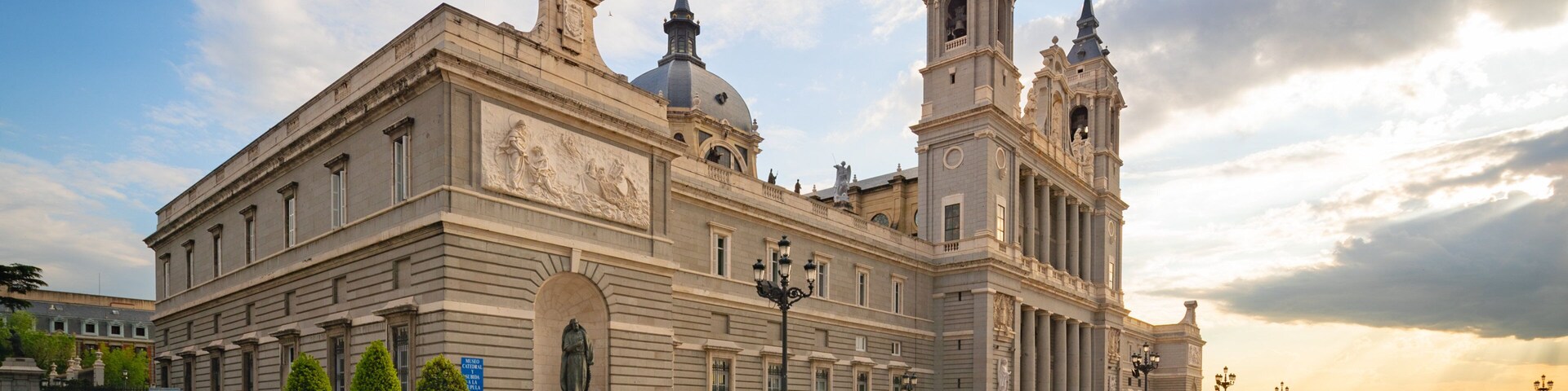 Almudena Cathedral featuring a sunset, heritage architecture and a church or cathedral