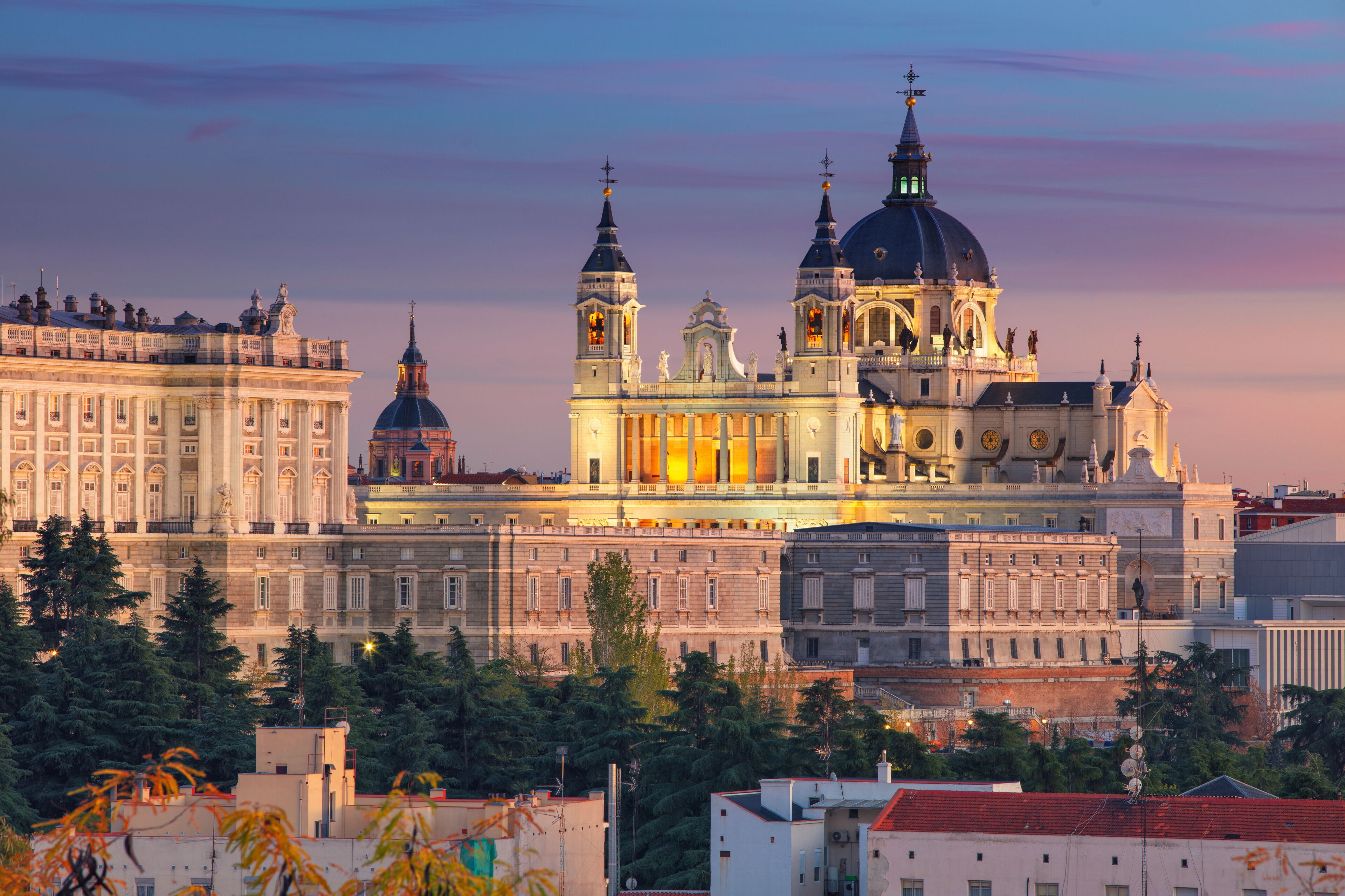 Madrid. Image of Madrid skyline with Santa Maria la Real de La Almudena Cathedral and the Royal Palace during sunset.