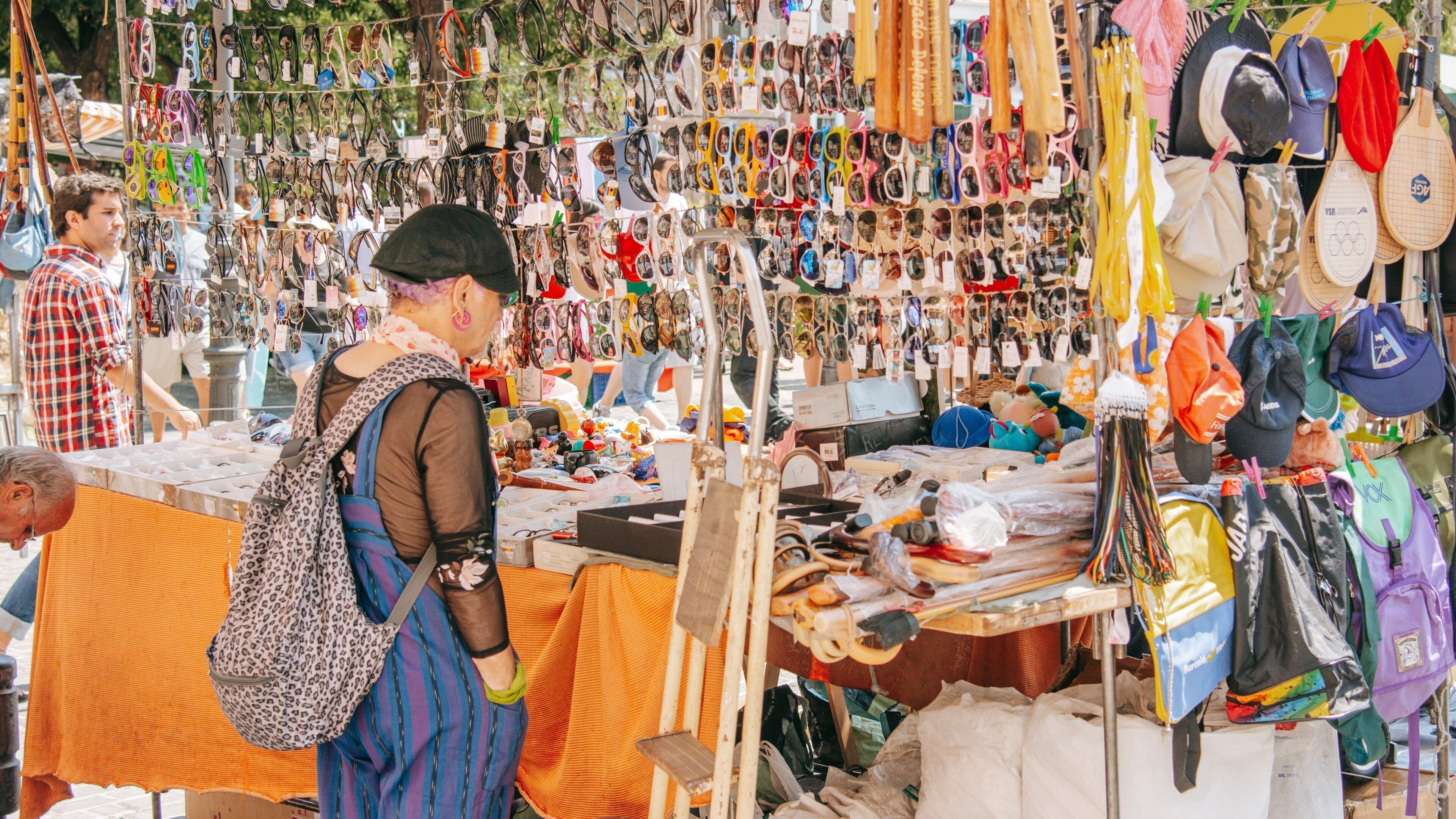 El Rastro featuring markets as well as an individual femail