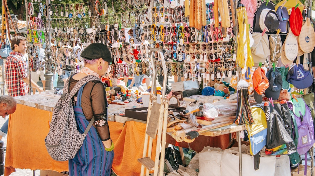 El Rastro featuring markets as well as an individual femail