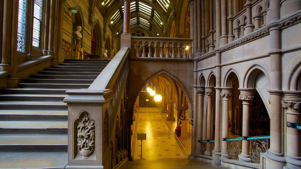 A grand staircase with ornate columns and a vaulted ceiling.