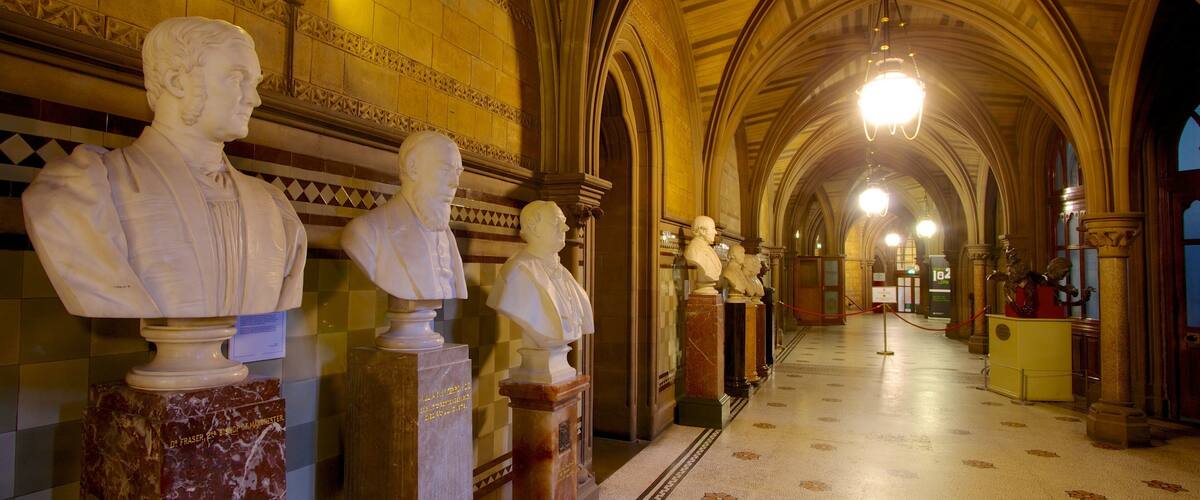 Manchester City Hall which includes interior views, a statue or sculpture and heritage architecture