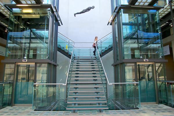 Manchester Art Gallery showing interior views and art as well as an individual female