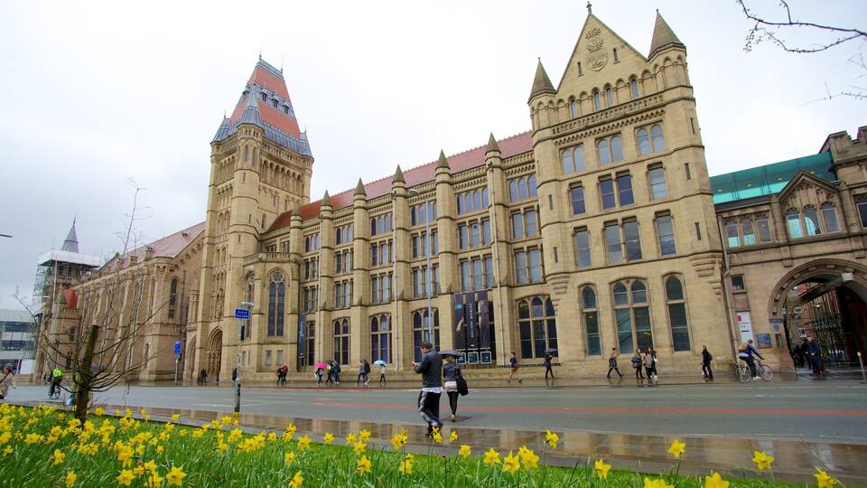 A historic building with a clock tower and arched windows.
