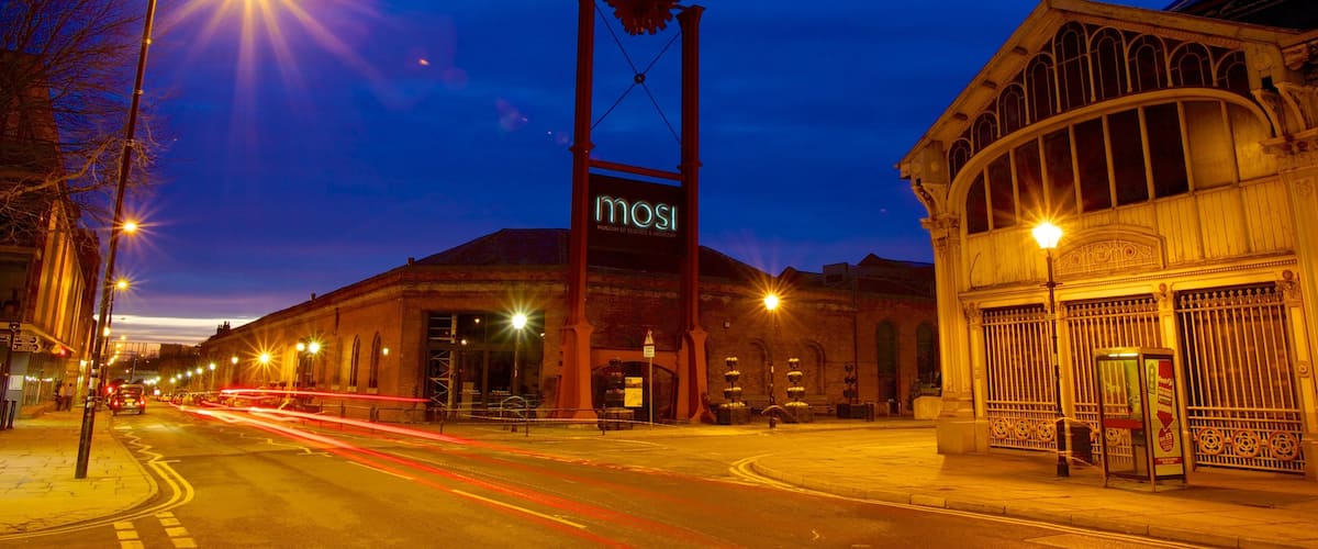 Museum of Science and Industry featuring a sunset, night scenes and a city