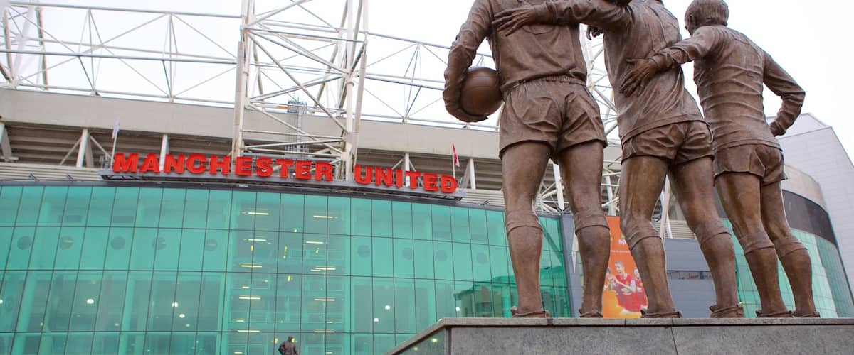 Old Trafford which includes a statue or sculpture