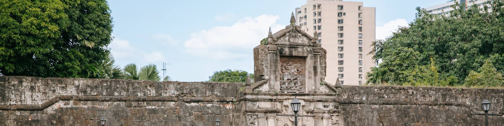Fort Santiago showing heritage architecture, land animals and horseriding
