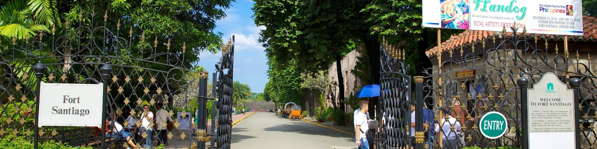 A gate labeled "Fort Santiago" with a sign for "Handog" and "Intramuros Visitors Center".