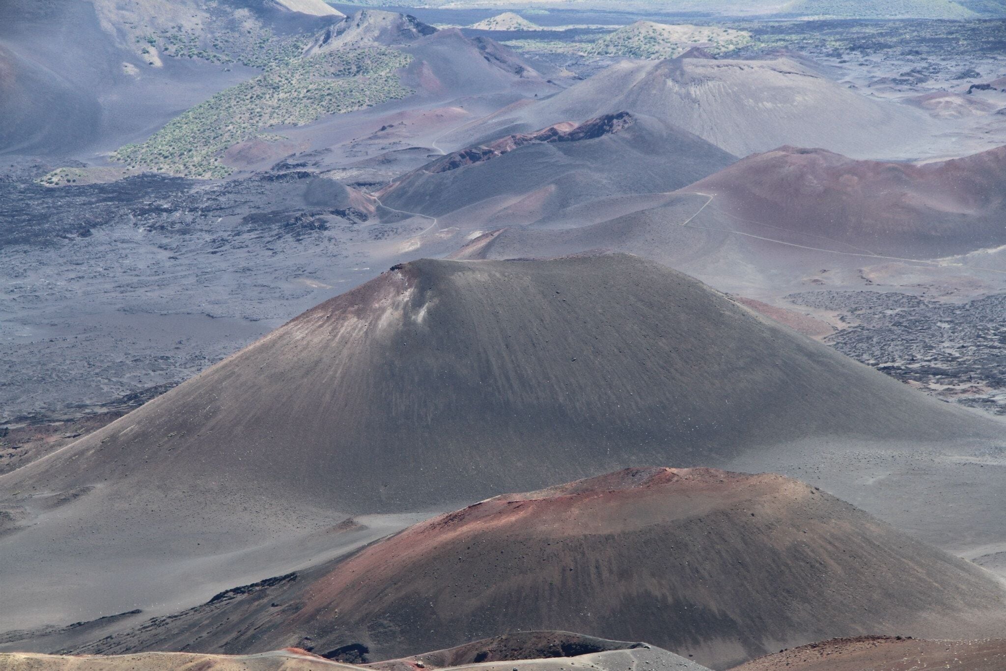 Haleakala Crater, now a dormant volcano,completely dominates the landscape of east of Maui.The spectacular desolation of its enormous crater valley- 7.5 miles long, 2.5 miles wide and 3,000 ft deep has been compared to the mountains of the moon. Pastel hues of red,yellow, orange as well as gray purple brown black and pink accent cliff sides and cinder cones.its worth waking up in the dark of early morning to drive from beach front resort and watch the sunrise over Haleakala 10,023 foot summit.
#NationalPark
