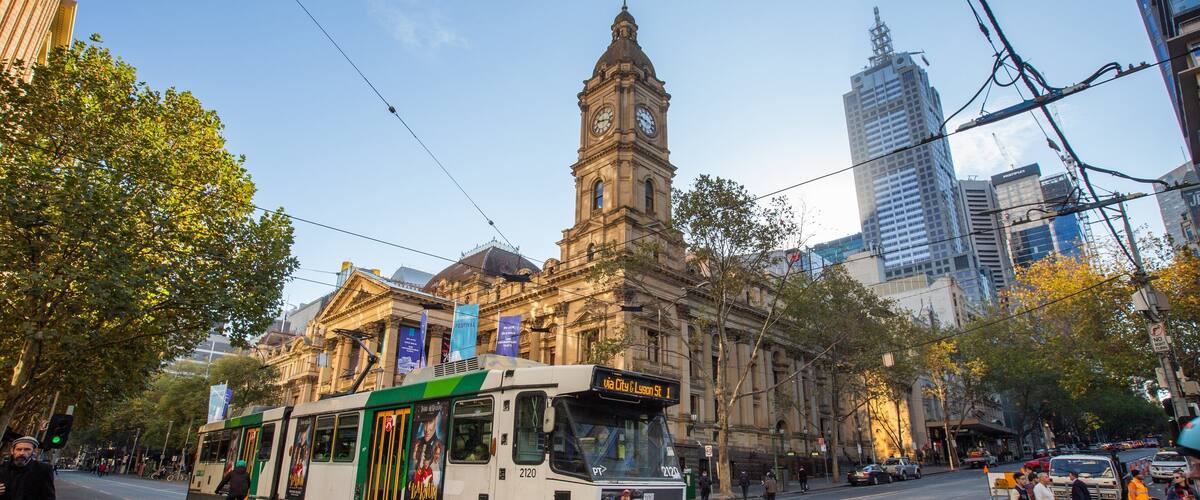 Melbourne Town Hall showing a city, railway items and heritage architecture
