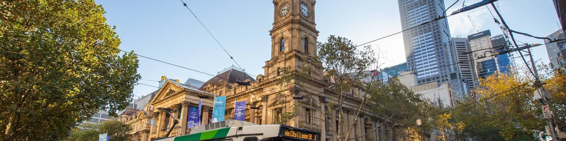 Melbourne Town Hall showing a city, railway items and heritage architecture