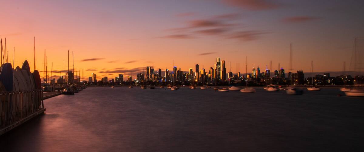 St Kilda Pier showing a sunset, a city and a bay or harbor