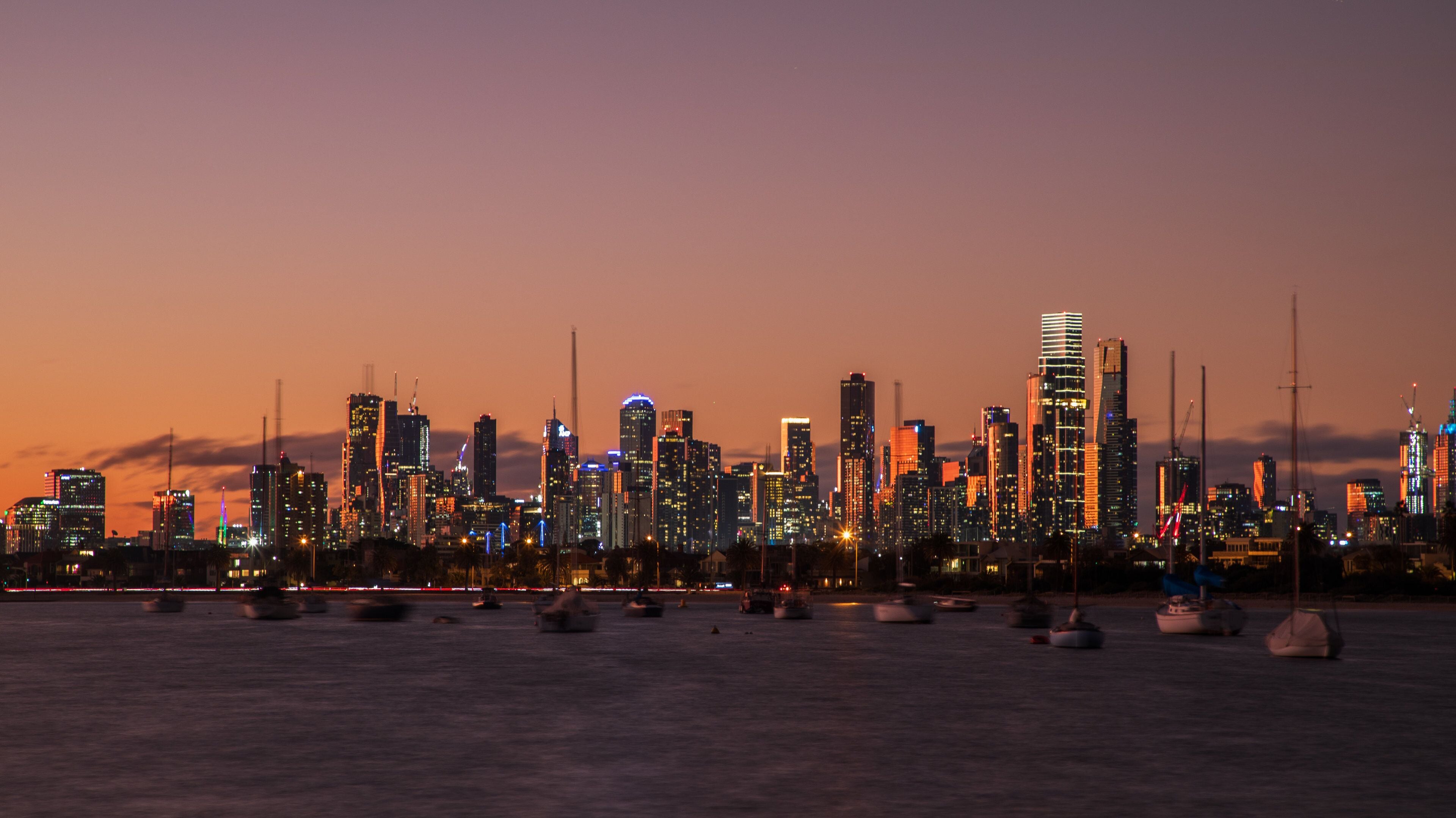 St Kilda Pier showing a city, a sunset and a bay or harbor