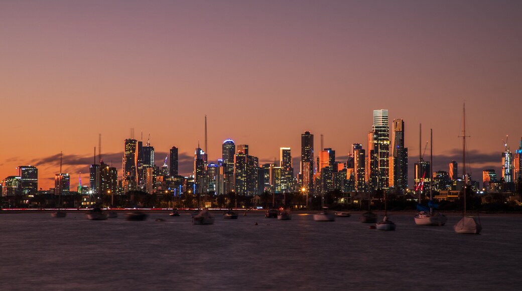 St Kilda Pier showing a city, a sunset and a bay or harbor