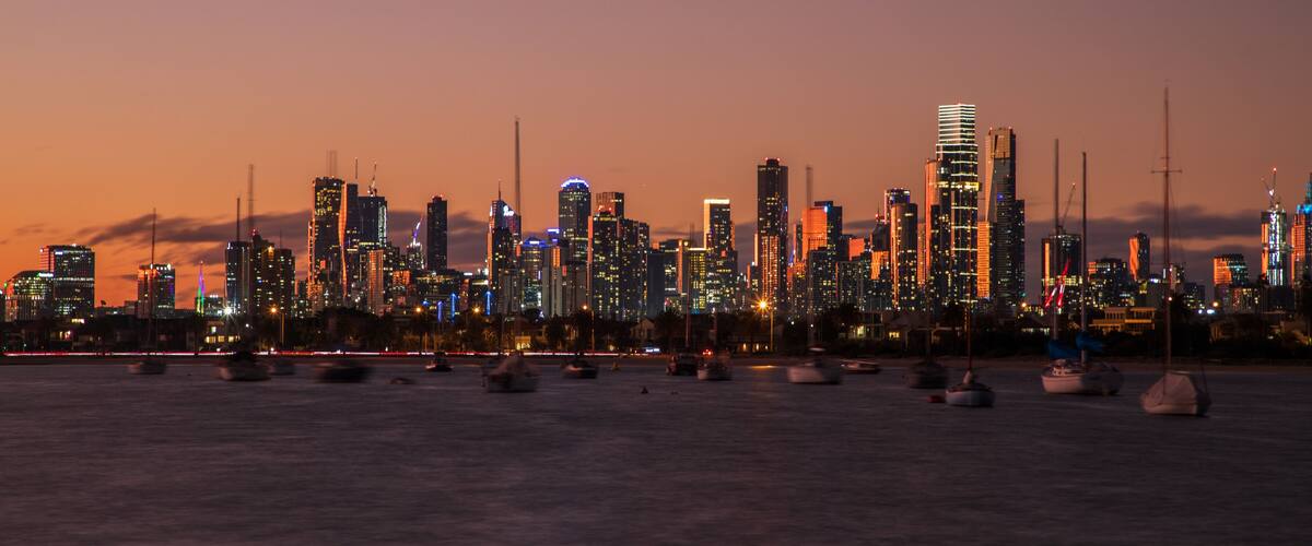 St Kilda Pier showing a city, a sunset and a bay or harbor