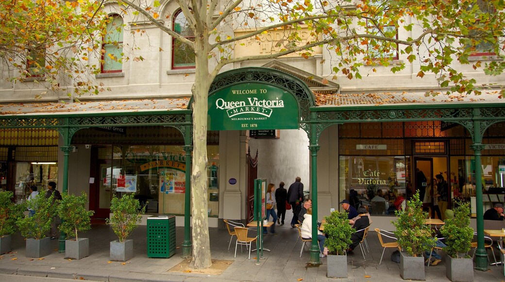 Queen Victoria Market que incluye escenas cotidianas, comidas al aire libre y señalización