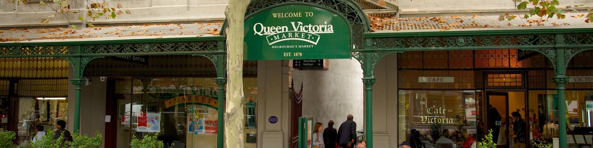 Queen Victoria Market featuring signage, markets and street scenes