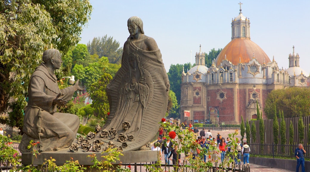 Basilica of Our Lady of Guadalupe showing a square or plaza and a statue or sculpture