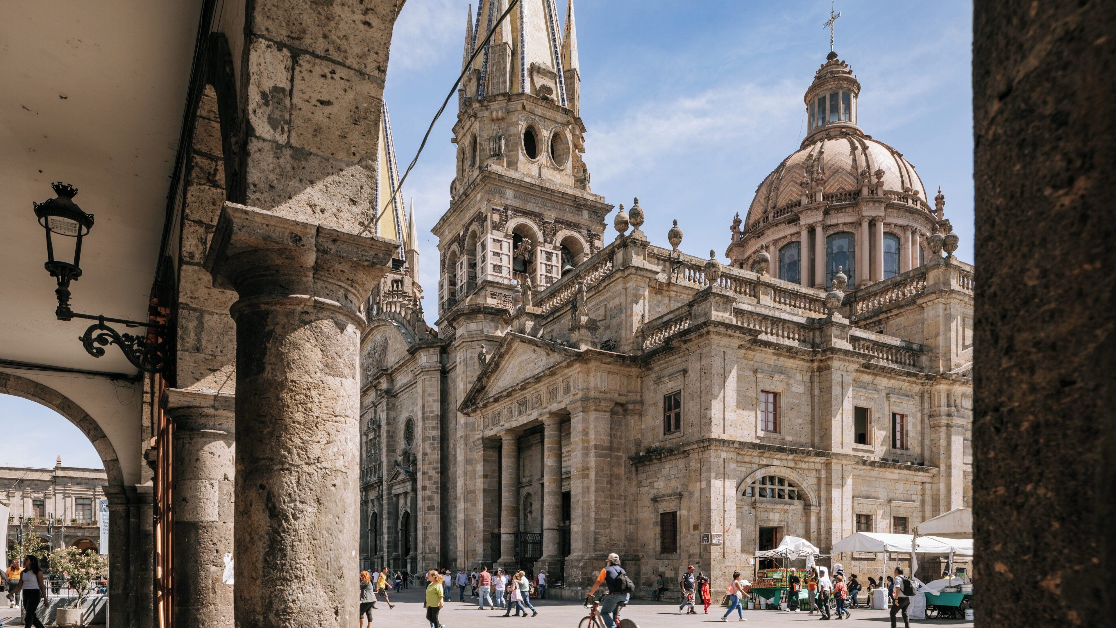 Visit to the Metropolitan Cathedral in Cuauhtemoc, Mexico City, showcasing its architectural beauty and surrounding activities during a sunny day
